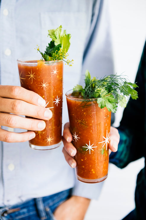 Load image into Gallery viewer, two glasses of bloody mary mix in a cheers
