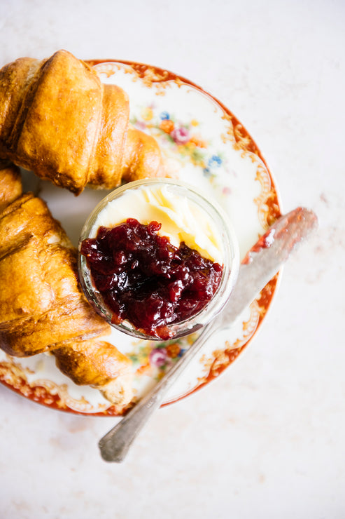 Load image into Gallery viewer, Croissants next to a bowl of preserves and butter