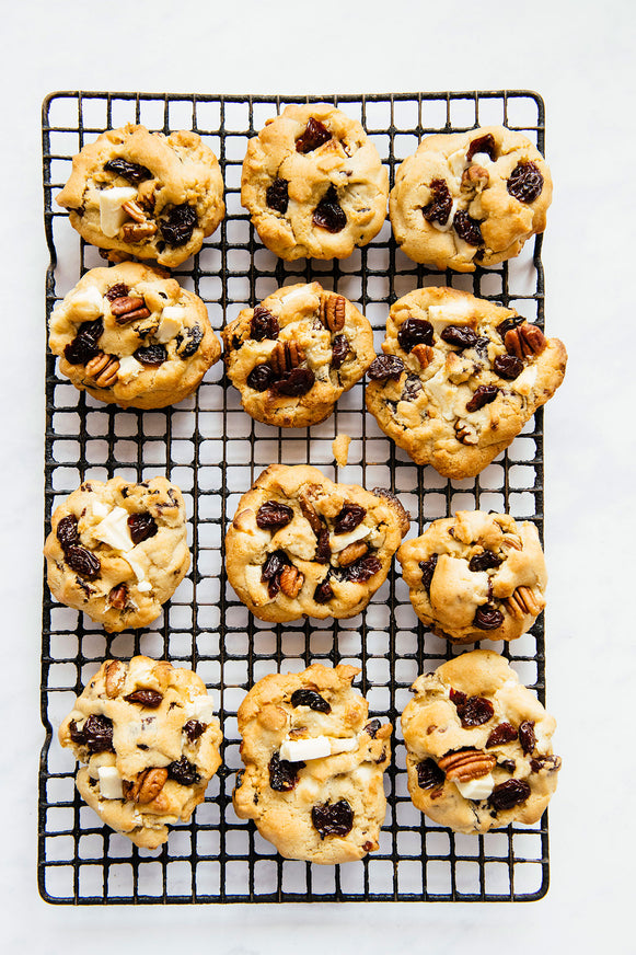 homemade cookies with dried tart cherries, white chocolate and pecans on a cooling rack
