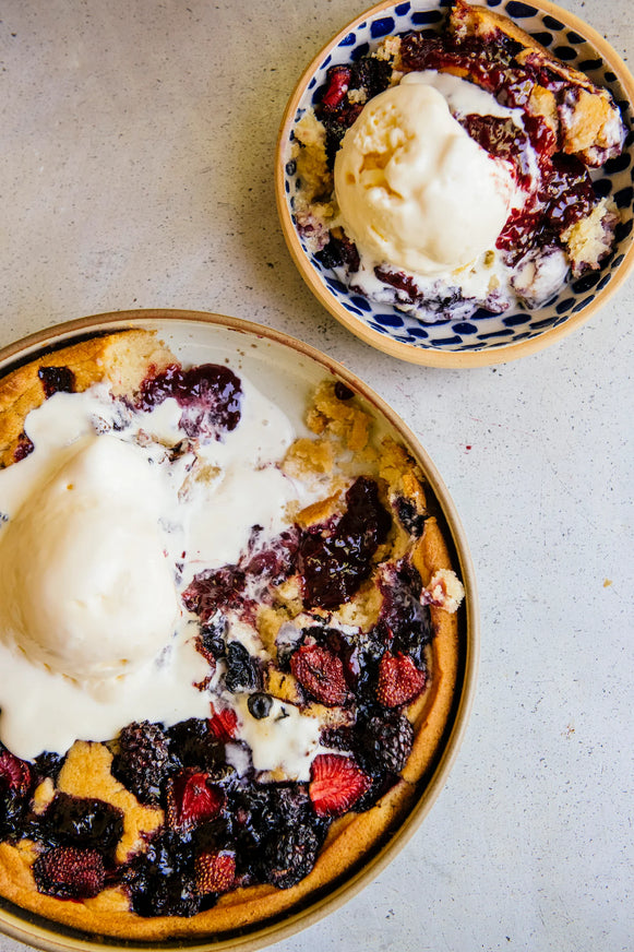 fresh berry cobbler topped with vanilla ice cream