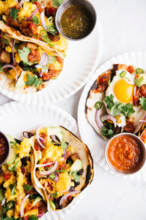 Load image into Gallery viewer, breakfast tacos filled with eggs, onions and cilantro topped with american spoon salsa