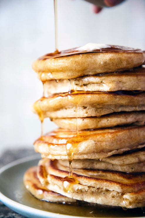 Load image into Gallery viewer, A stack of pancakes drizzled with Maple Syrup
