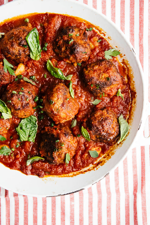 Load image into Gallery viewer, Large rustic bowl of meatballs and sauce sprinkled with fresh herbs