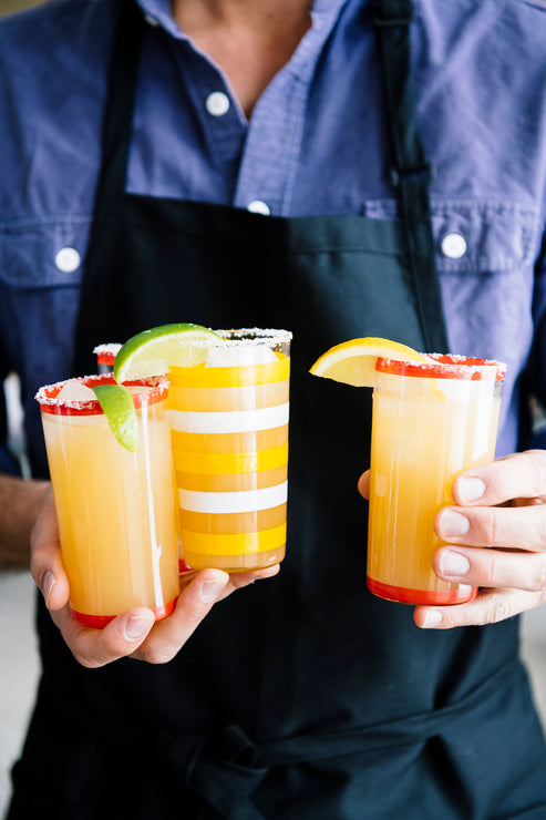 Load image into Gallery viewer, A man holding glasses of homemade margaritas