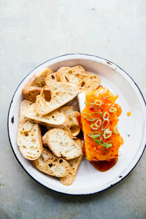 Load image into Gallery viewer, slices of baguette next to a block of cream cheese topped with jalapeno pepper jelly