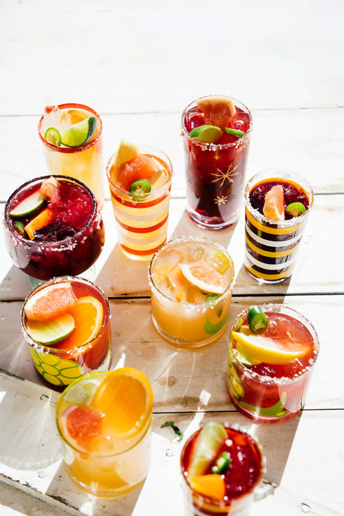 Load image into Gallery viewer, glasses of homemade cocktails with fresh fruit garnishes
