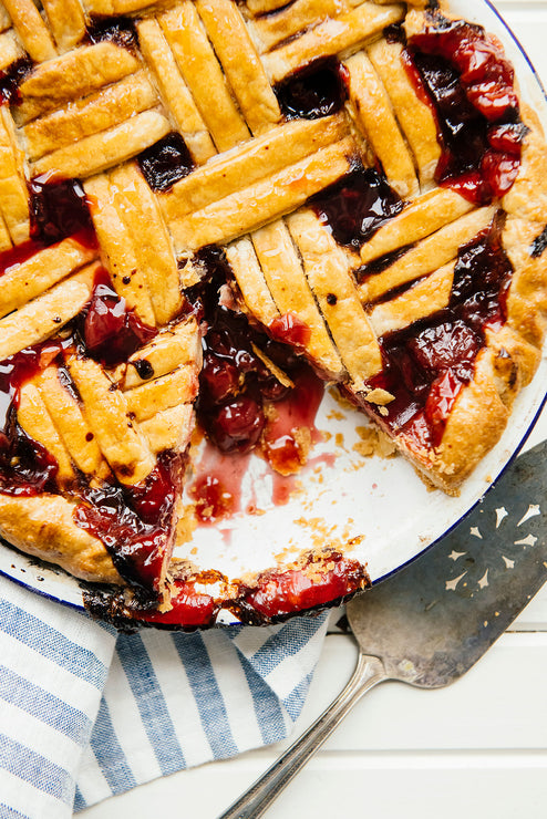 Load image into Gallery viewer, homemade lattice cherry pies made with fruit perfect sour cherries