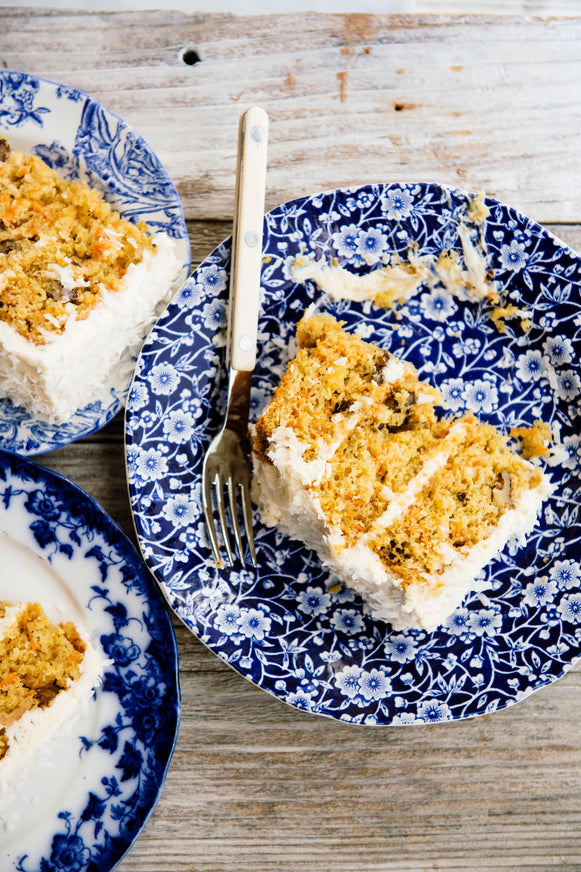 homemade carrot cake slices with maple cream frosting