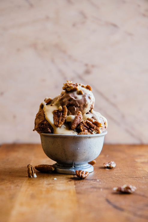 Load image into Gallery viewer, an ice cream sundae topped with salted maple caramel and pecans