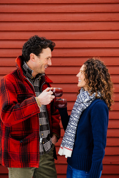 Load image into Gallery viewer, a husband and wife drinking holiday punch in front of a red barn