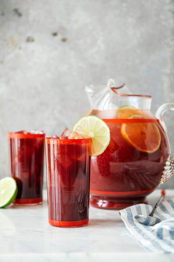 a pitcher of cherry lime punch