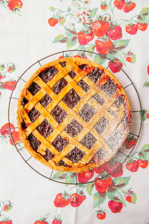 Load image into Gallery viewer, a homemade strawberry tart with a lattice topping