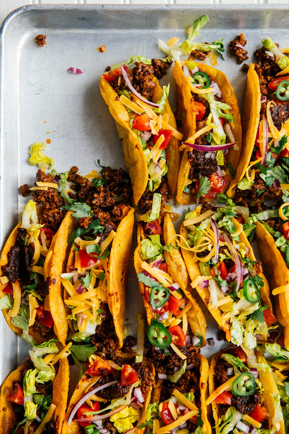 A tray of ground beef tacos made with Dried Chile Salsa