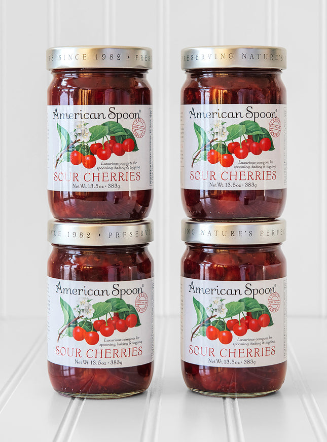 A stack of four jars of Fruit Perfect Sour Cherries