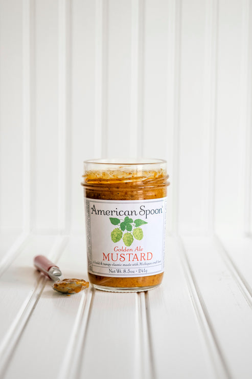 Load image into Gallery viewer, A jar of American Spoon Golden Ale Mustard set against a white beadboard background.