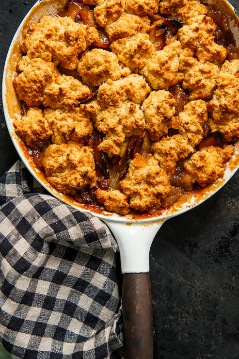 Load image into Gallery viewer, peach cobbler topped with homemade biscuits