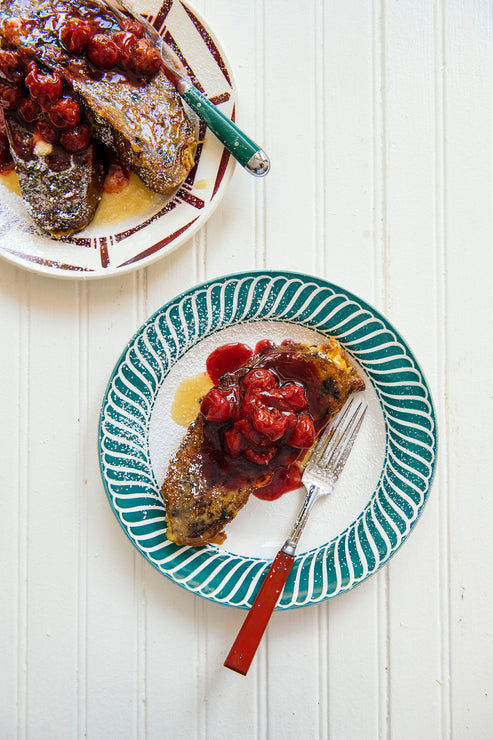 Load image into Gallery viewer, slices of Midwest Stollen french toast topped with maple syrup and cherries