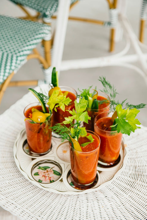 Load image into Gallery viewer, a tray of bloody mary mix topped with fresh garnishes