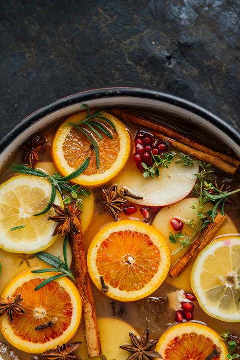 Load image into Gallery viewer, Spiced Cider Punch in a simmer pot with fresh citrus slices, cinnamon, star anise and pomegranates.