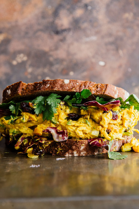 a chicken salad sandwich made with apricot preserves and dried tart cherries