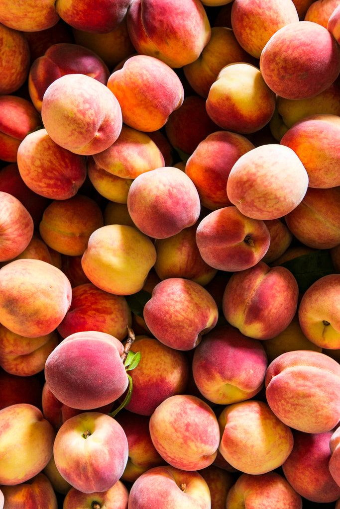 a pile of fresh peaches