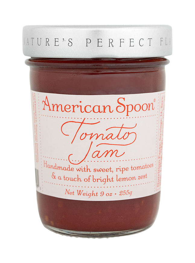 Jar of American Spoon Tomato Jam with a white label on a white background