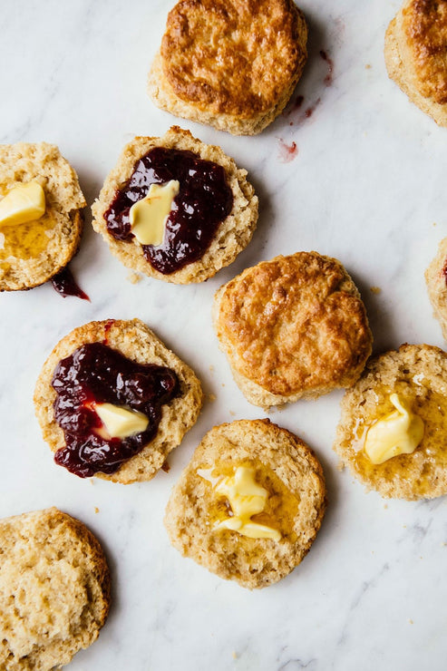 Load image into Gallery viewer, Homemade biscuits with jam, honey & butter on a marble surface