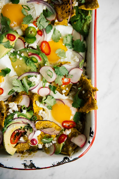 Load image into Gallery viewer, A pan of breakfast chiliquiles with Tomatillo Salsa