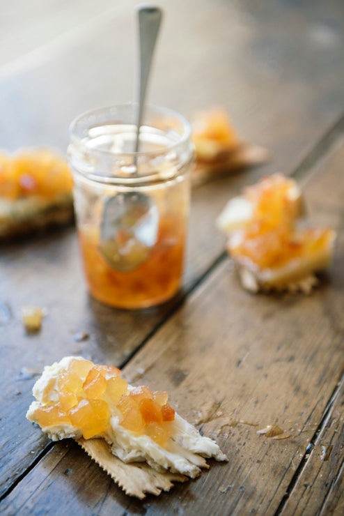 Load image into Gallery viewer, Peach Habanero Jelly on top of cheese and crackers
