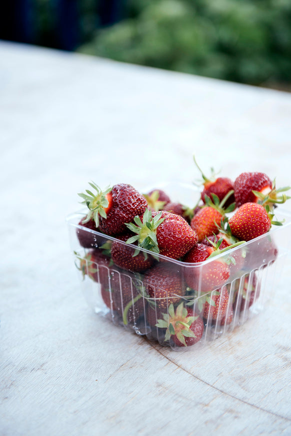 Berry pint basket full of fresh strawberries