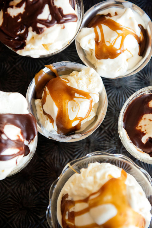 Load image into Gallery viewer, Cups of ice cream topped with Salted Maple Caramel and Chocolate Fudge Sauce