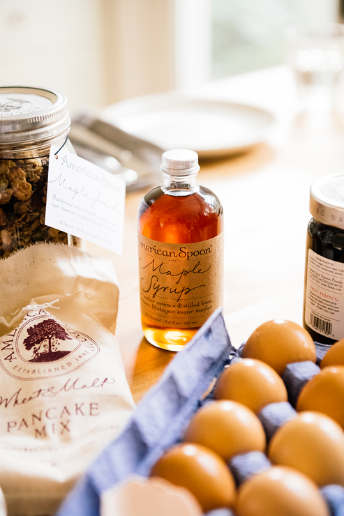 Load image into Gallery viewer, Kitchen table full of Maple Syrup, Wheat & Malt Pancake Mix and a carton of eggs
