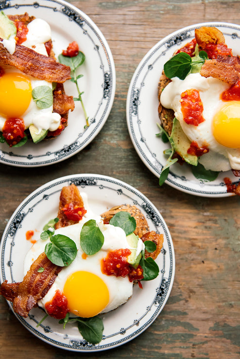 Load image into Gallery viewer, A breakfast sandwich topped with Chili Jam and avocado