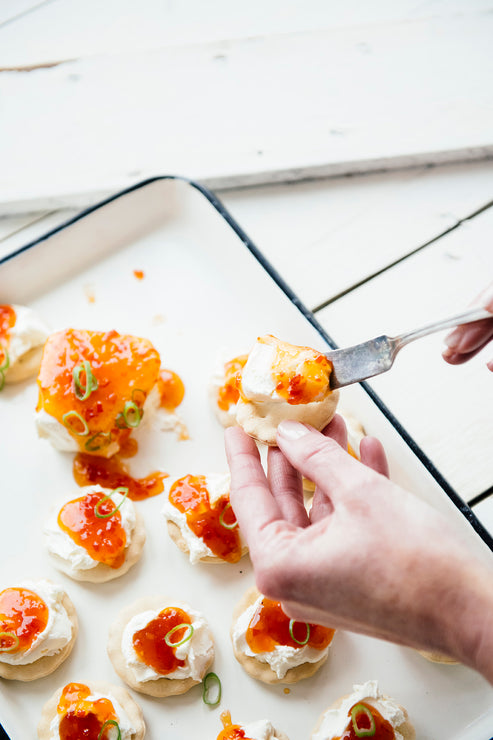 Load image into Gallery viewer, Crackers topped with cream cheese and Jalapeno Pepper Jelly