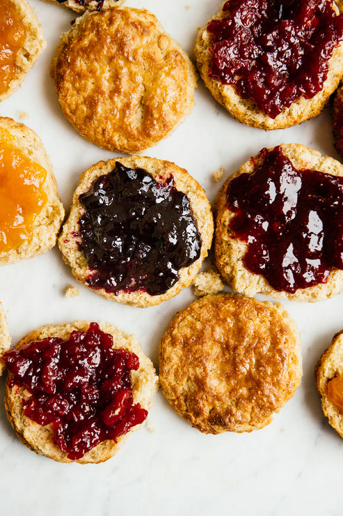 Load image into Gallery viewer, Open face homemade biscuits with preserves and Fruit Perfect spread on top
