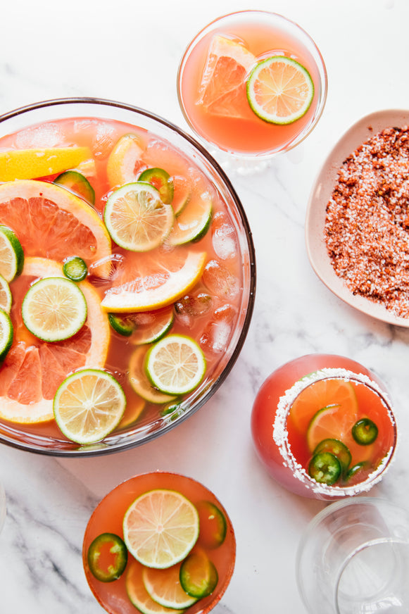 Cocktails made with Paloma Mix and citrus