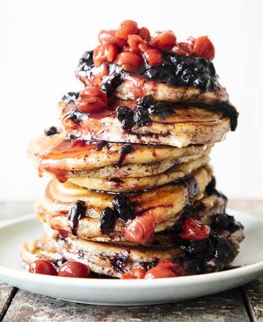 Load image into Gallery viewer, A stack of pancakes topped with Fruit Perfect Sour Cherries and Blueberries

