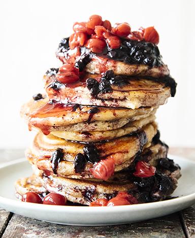 Load image into Gallery viewer, A stack of pancakes topped with Fruit Perfect Sour Cherries and Blueberries