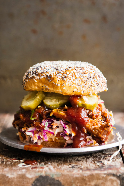 Load image into Gallery viewer, BBQ pulled pork sandwich with coleslaw and fresh pickles
