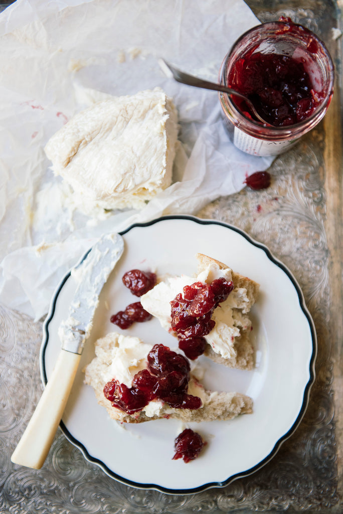 pieces of baguette topped with brie and preserves