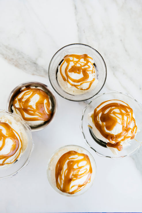 Load image into Gallery viewer, Bowls of ice cream topped with Salted Caramel Sauce
