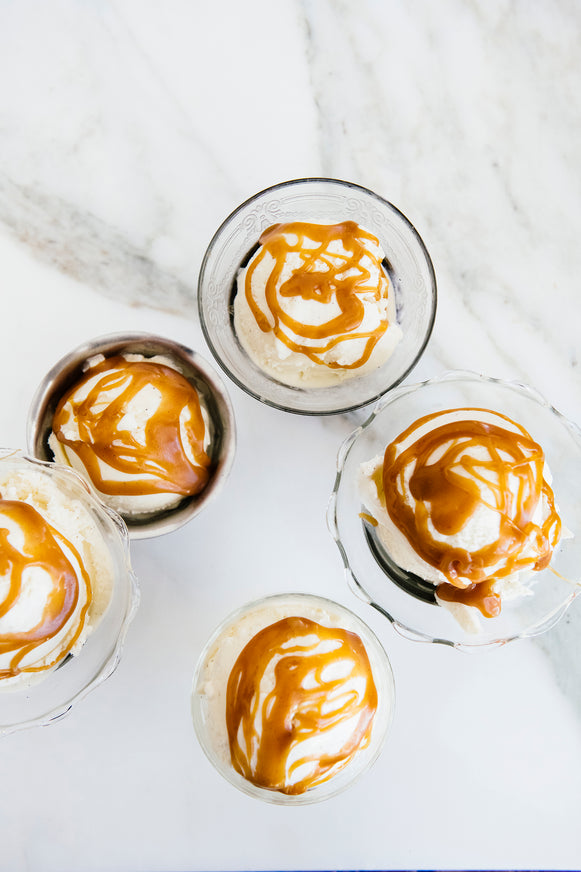 Bowls of ice cream topped with Salted Caramel Sauce