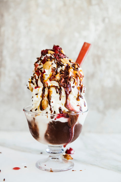 Load image into Gallery viewer, Vanilla ice cream sundae topped with Chocolate Fudge Sauce, Salted Maple Caramel and Sour Cherries
