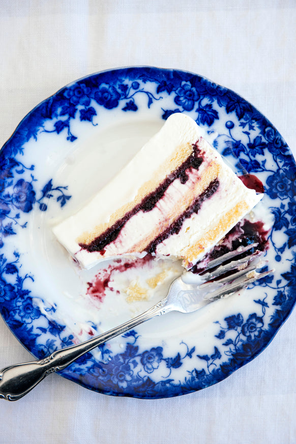 An ice box cake layeres with berry filling