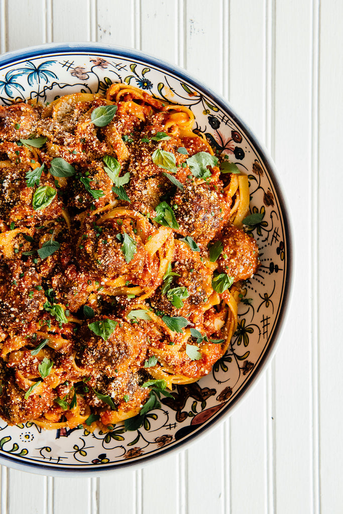 Pasta, meatballs and sauce in ceramic bowl 