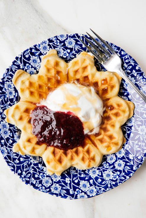 Load image into Gallery viewer, a waffle topped with fresh cream and preserves
