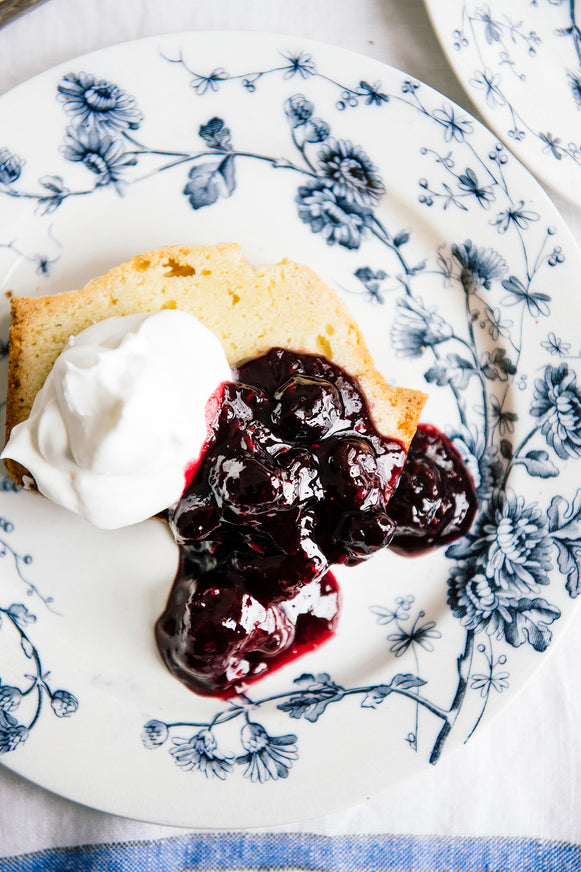 Pound cake topped with fresh whipped cream and American Spoon Fruit Perfect Blueberries