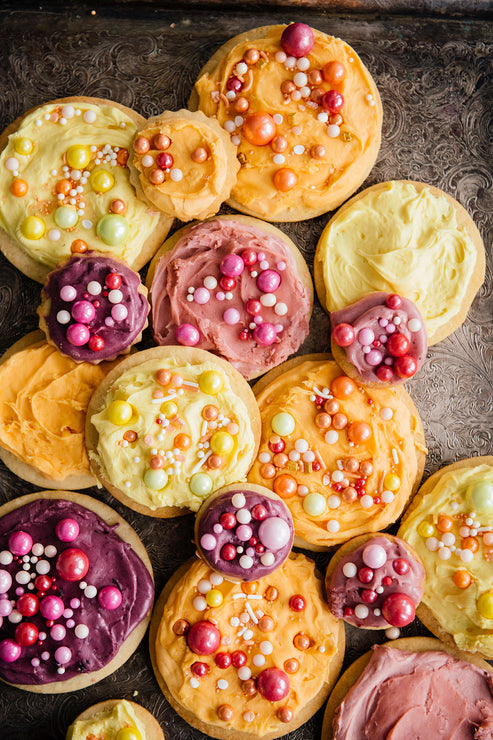 Load image into Gallery viewer, homemade sugar cookies topped with colorful frosting and sprinkles
