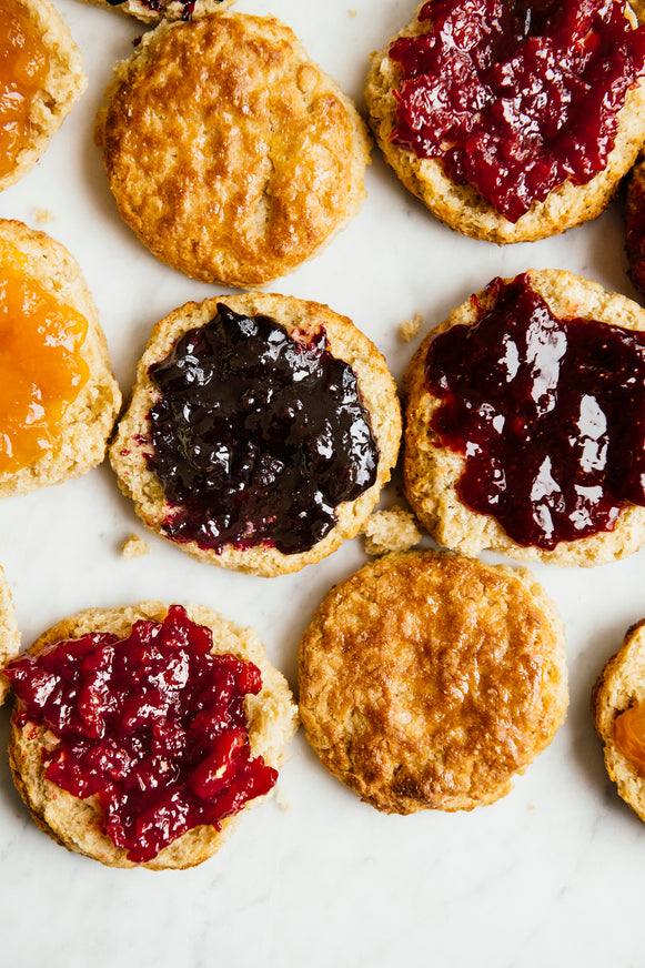 Open face biscuits spread with preserves