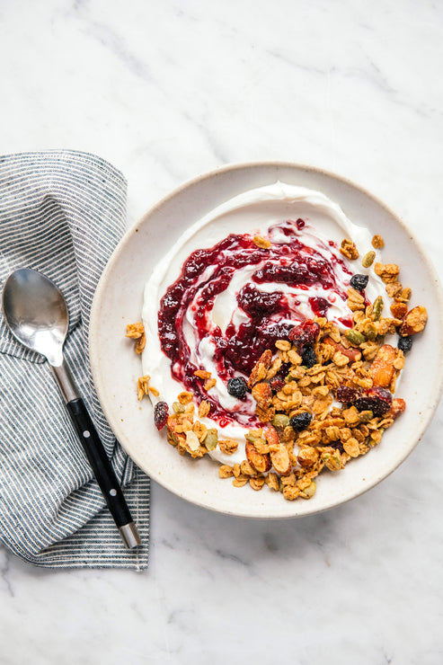 Load image into Gallery viewer, a bowl of yogurt topped with maple granola and preserves
